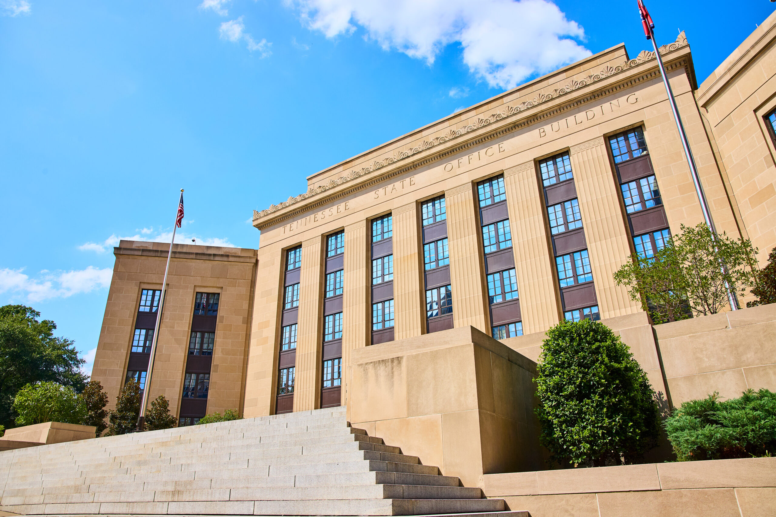 Tennessee State Office Building with American Flag Upward Perspective