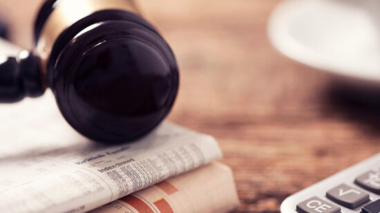 Newspaper and gavel